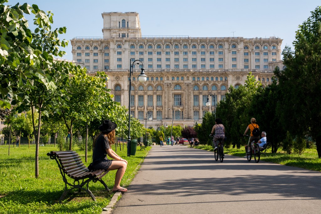 A view of the beautiful Unirii Boulevard in Bucharest, leading up to the impressive Palace of Parliament. Take a leisurely stroll and enjoy the stunning views of the city along the way.