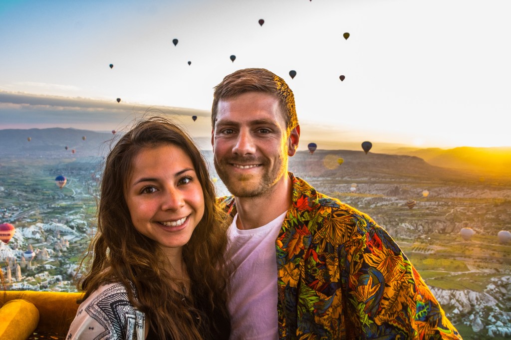 Bianca and Brett full of excitement as they prepare to take off on a hot air balloon ride over Cappadocia, Turkey - a unique and unforgettable experience with stunning views of the region.