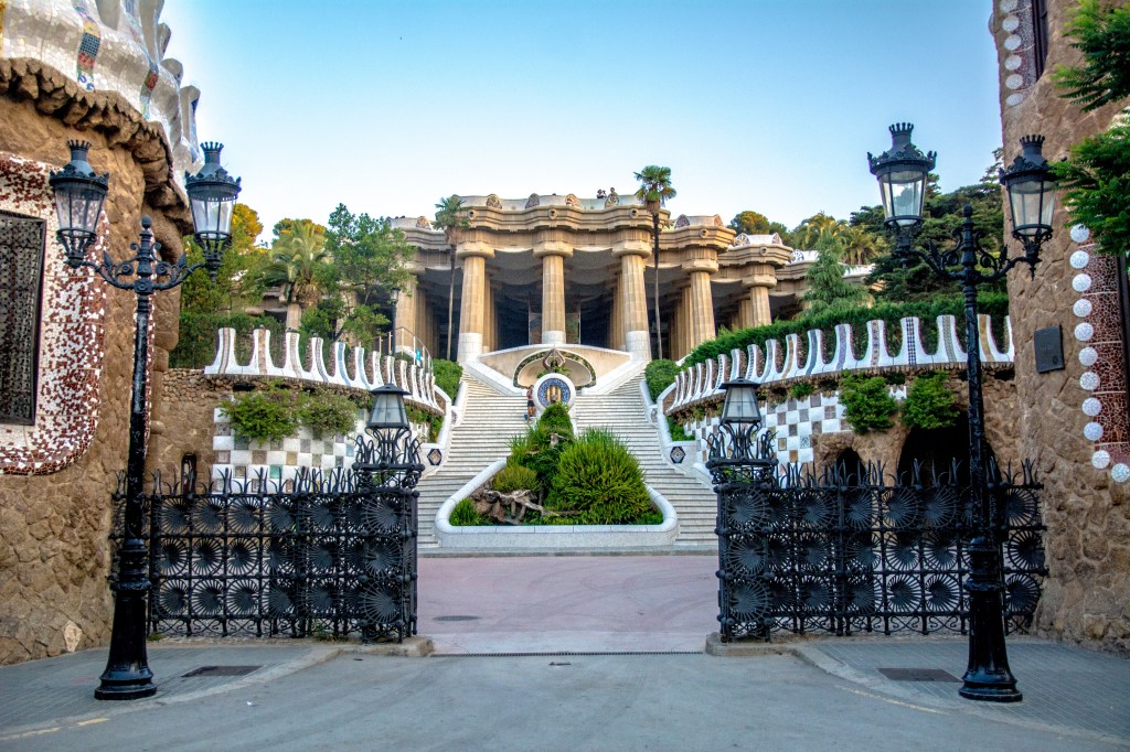 The fairytale architecture of Antoni Gaudi on display at Parc Güell in Barcelona, Spain, featuring whimsical mosaics, colorful tiles, and stunning views of the city.