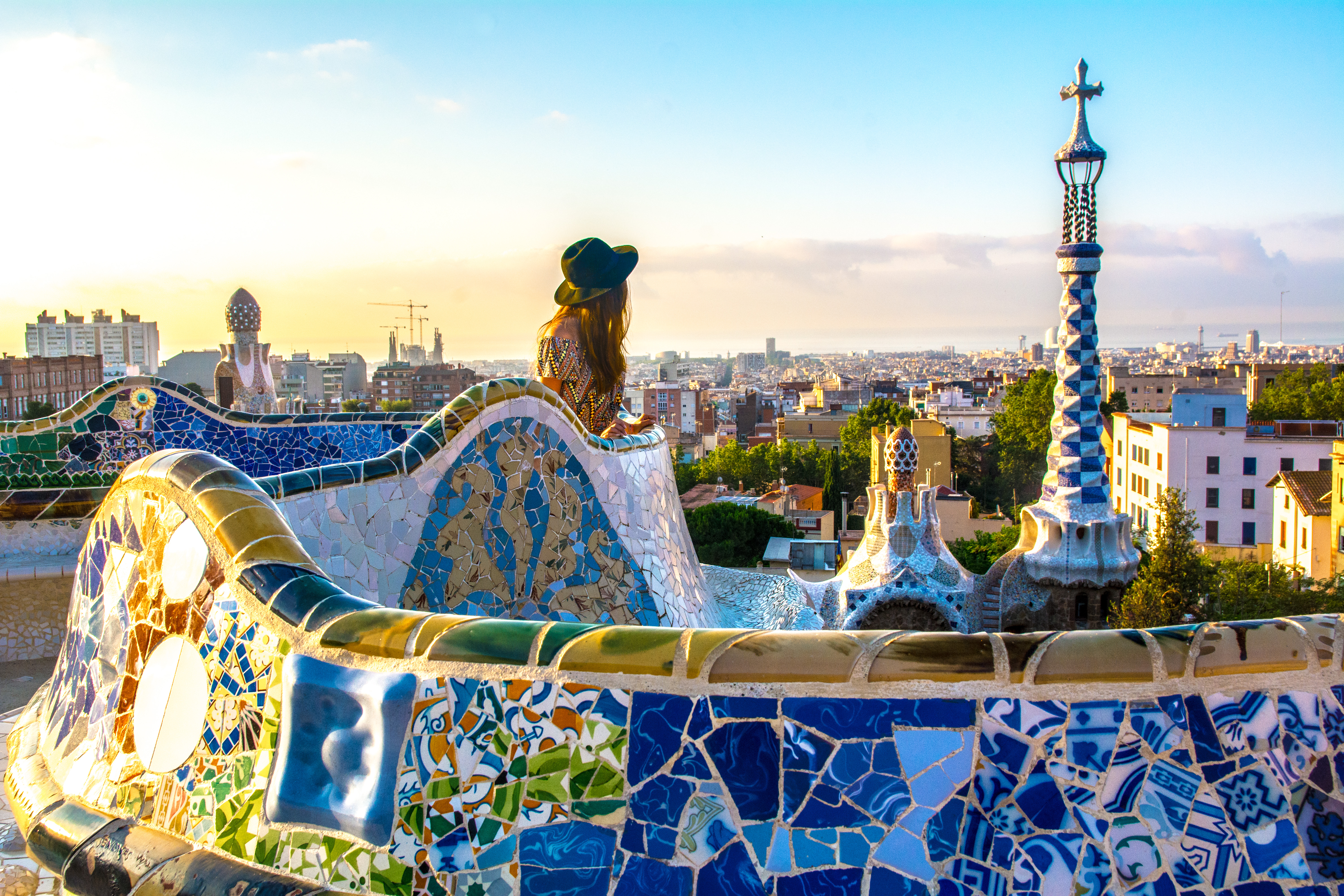 Antoni Gaudi's Parc Güell in Barcelona, Spain, featuring whimsical architecture, stunning views, and vibrant colors.