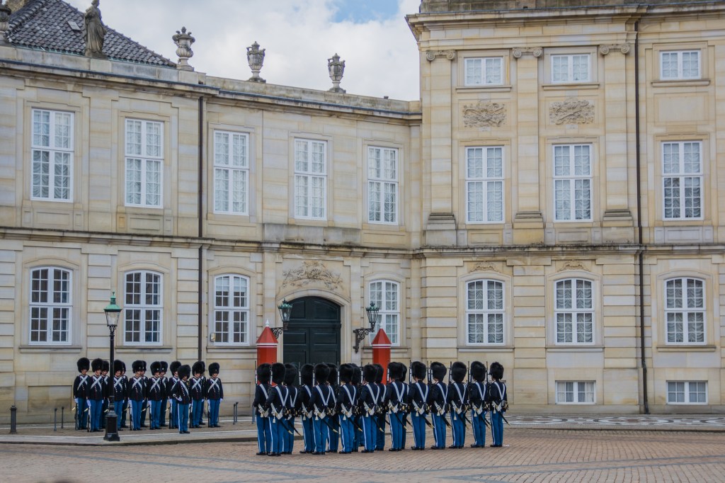 View of the Changing of the Guards ceremony at the Guard Barracks in Copenhagen, Denmark - a historic and impressive tradition. Don't miss this unforgettable experience during your visit to the city.