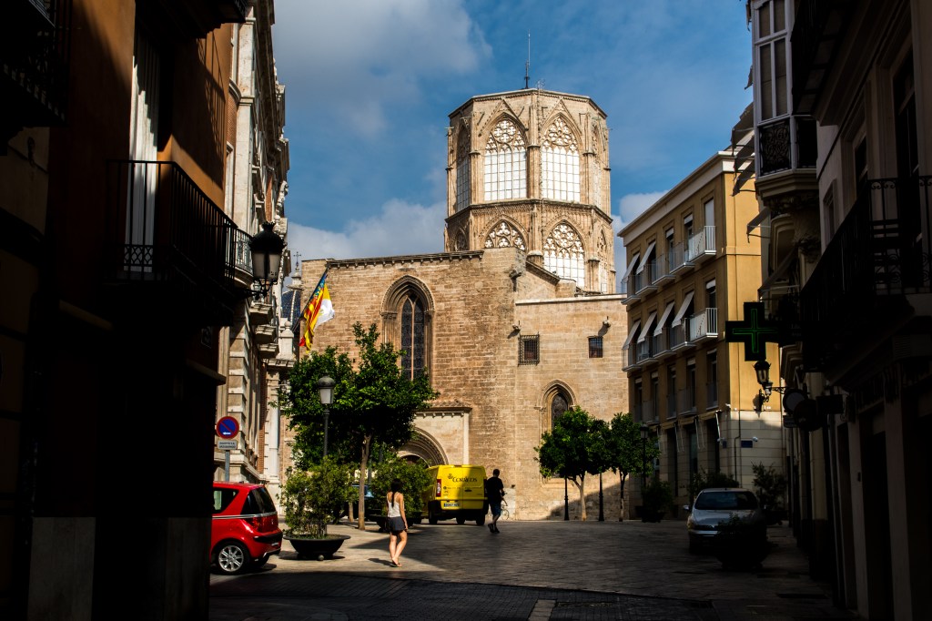 Bianca admiring the stunning architecture of Seville's historic church, known for its intricate details, impressive bell tower, and rich cultural significance.