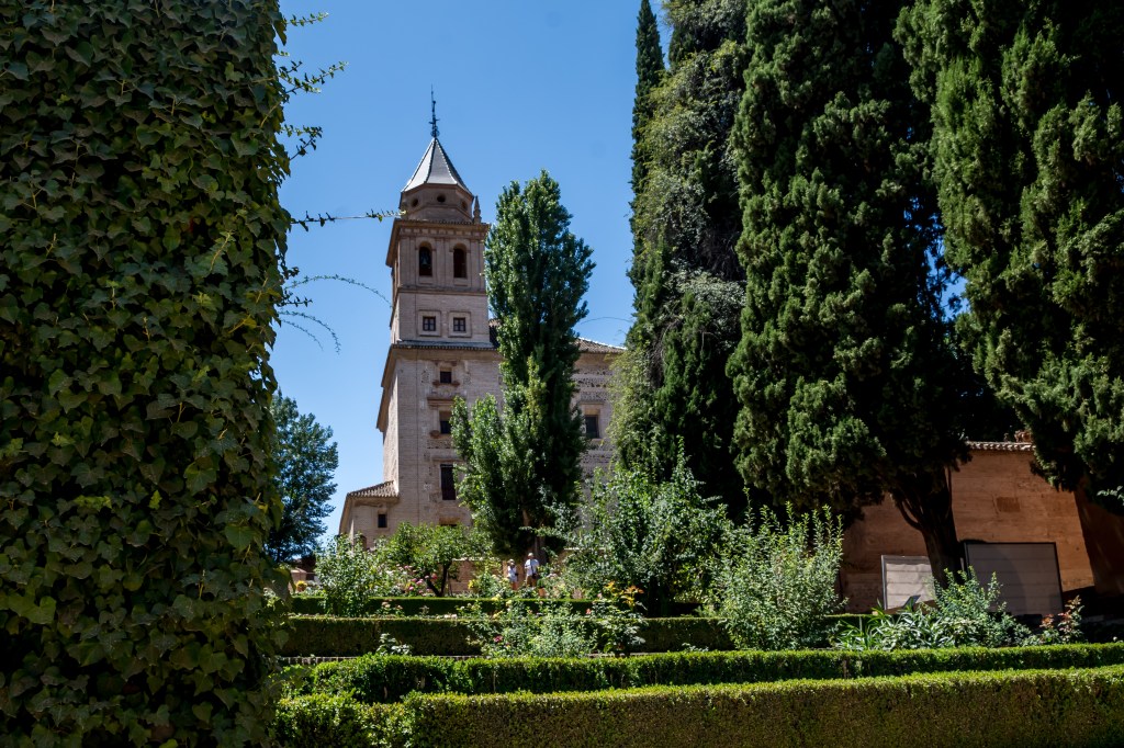 Capturing the stunning gardens of Real Alcazar, Seville's iconic palace complex known for its lush gardens, intricate architecture, and rich cultural history.
