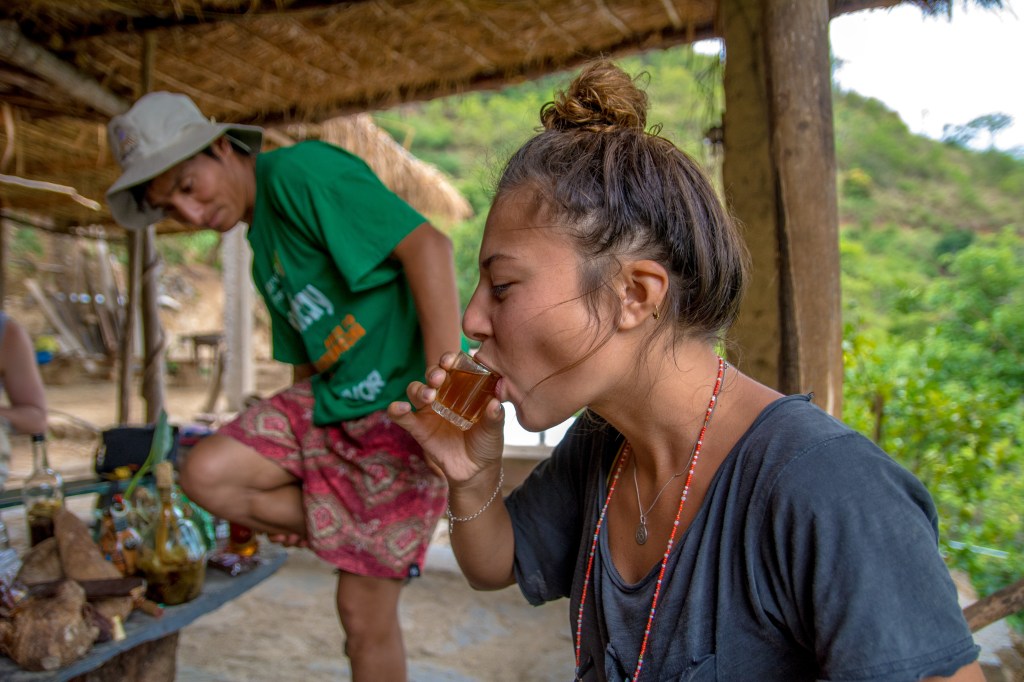 Bianca enjoying a local drink at Monkey House, a vibrant spot for drinks and entertainment.