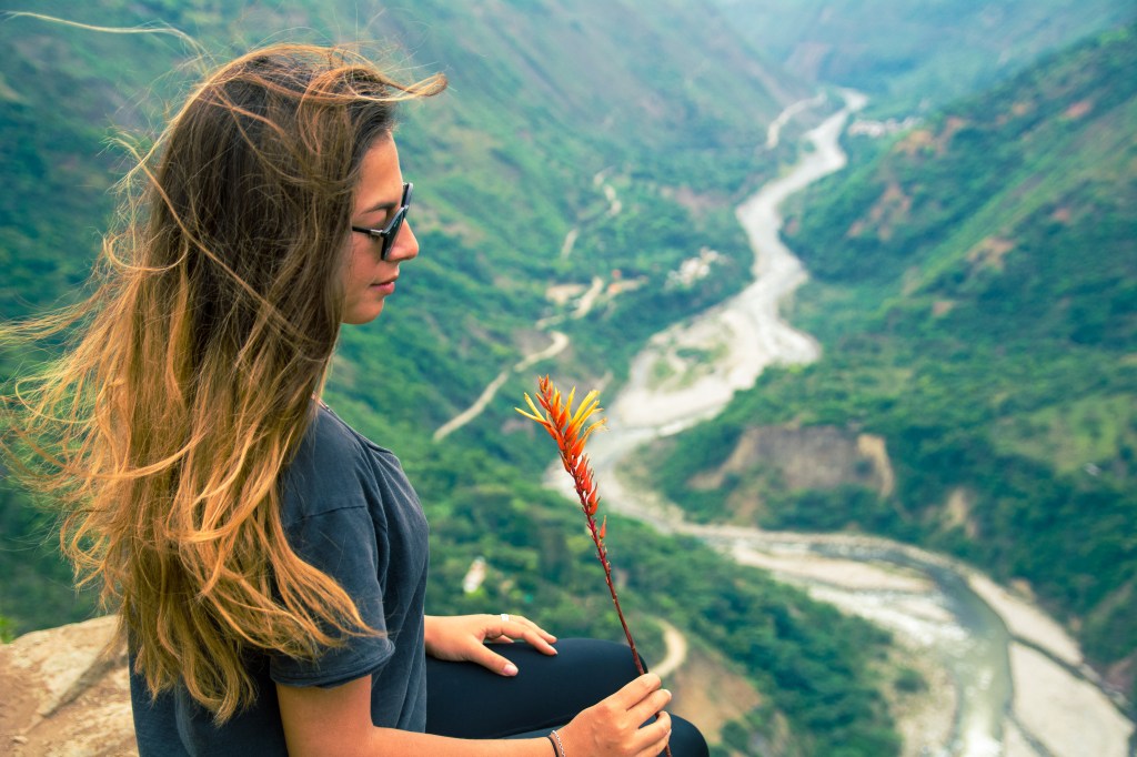 Paying tribute to Pachamama on a mountain hike, expressing gratitude and seeking safe passage.
