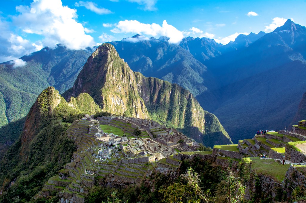 Iconic view of Machu Picchu, the ancient Inca citadel in Peru, nestled amidst the majestic mountains.