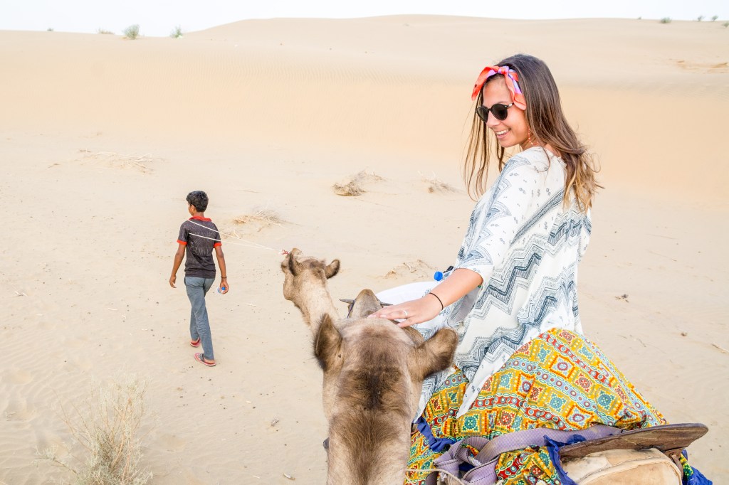 Bianca enjoying a camel ride in the stunning Great Indian Desert, an unforgettable experience.