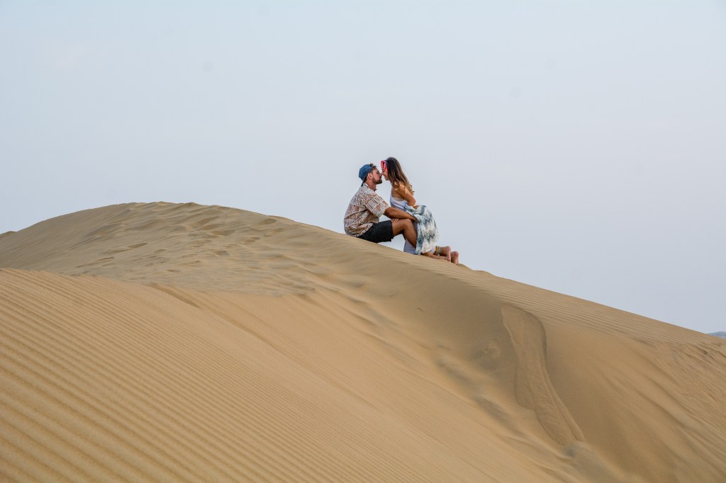Bianca and Brett immersing themselves in the serenity of the desert dunes, creating unforgettable memories.