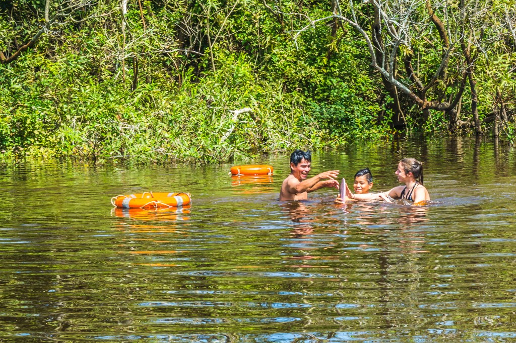 Swimming with Pink Dolphins in the Amazonian River - an unforgettable experience.