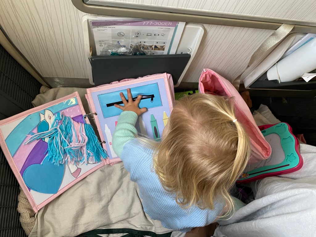 Busy book on a plane is great to keep your little one busy.