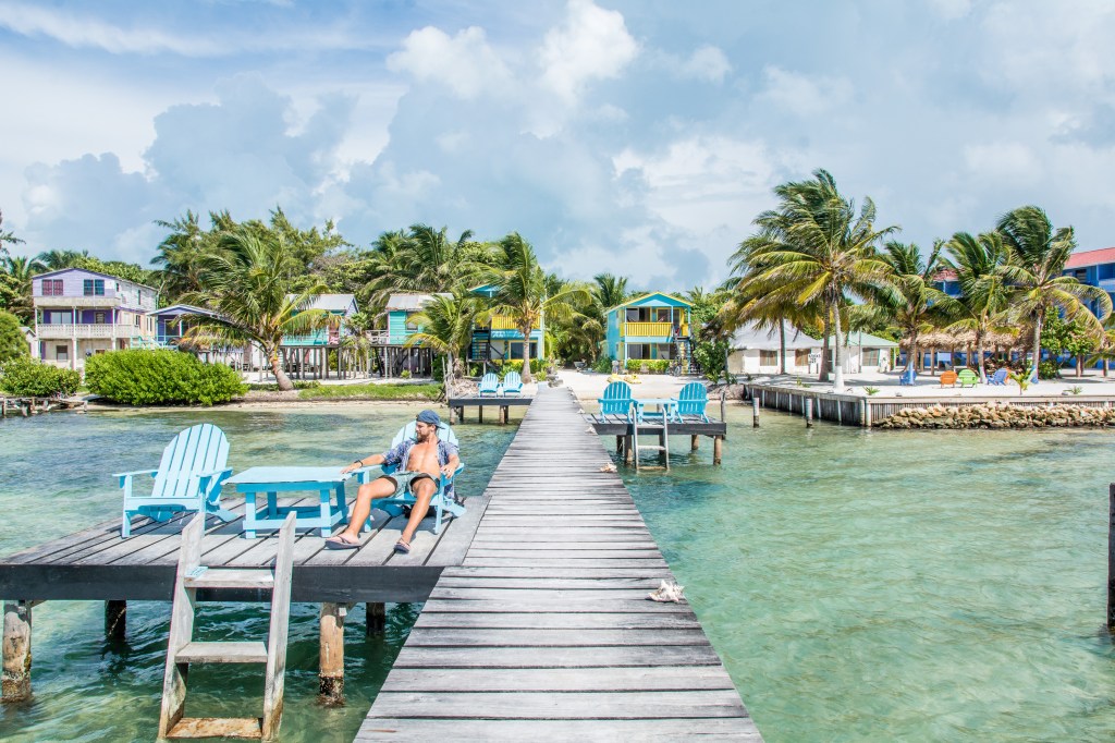 Relaxing on a Wharf in Caye Caulker, Belize - Brett Enjoying Tranquil Moments | Travel Blog