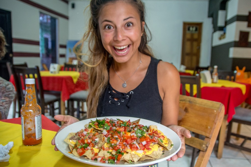 Bianca Indulging in Flavorful Guatemala Nachos - Culinary Delight in Every Bite