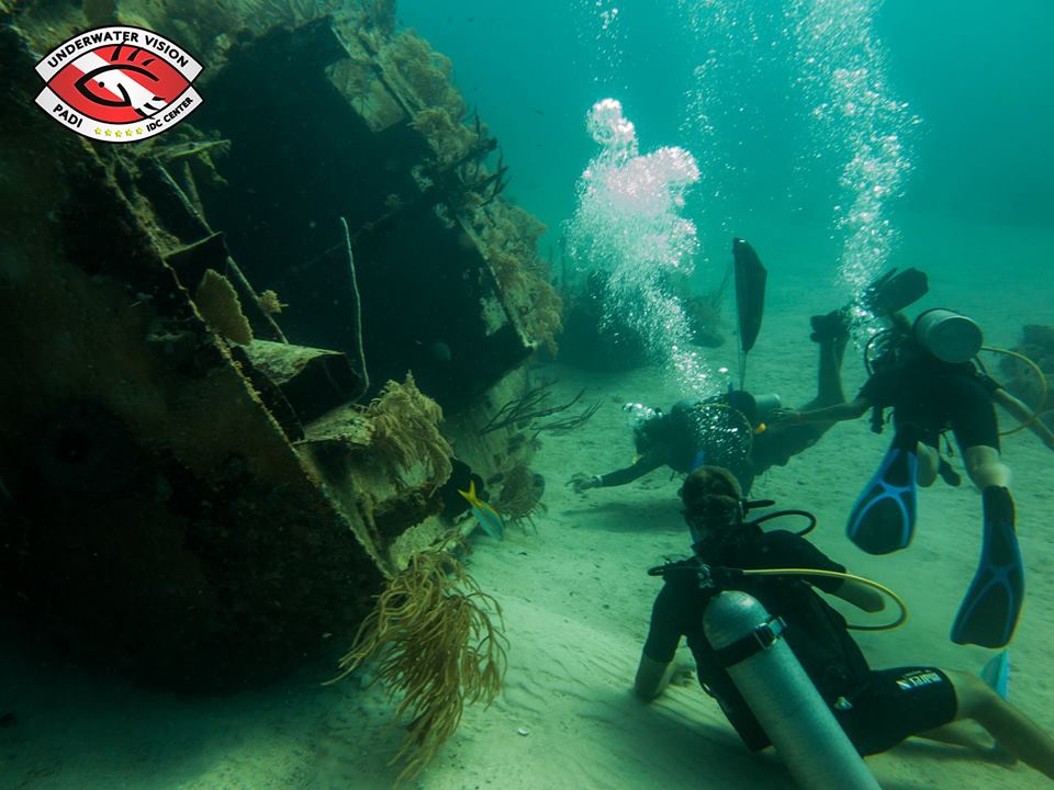 Bianca and Brett Ready to Explore a Shipwreck near Utila Island, Honduras.