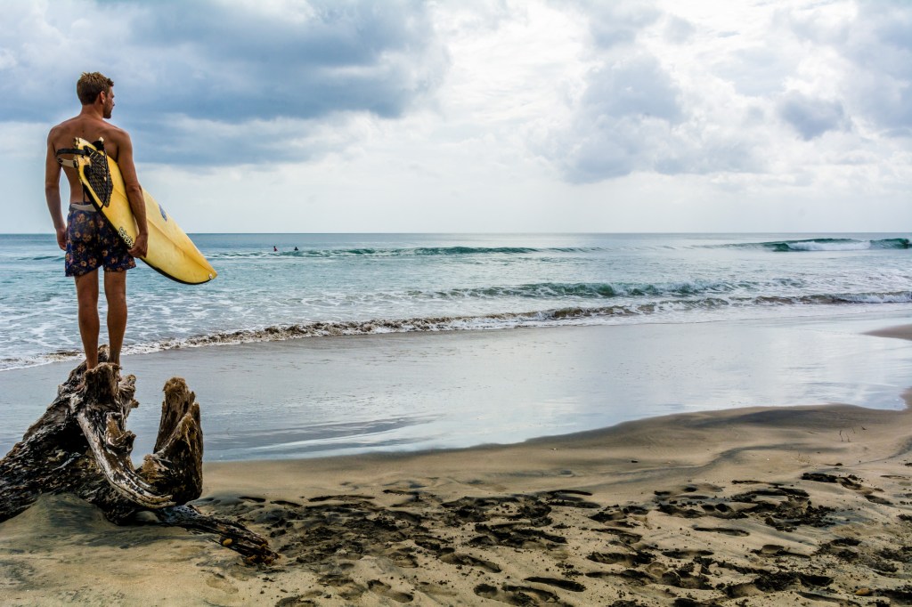 Brett Surveying the Surf at Playa Colorado - Nicaragua's Surfing Haven
