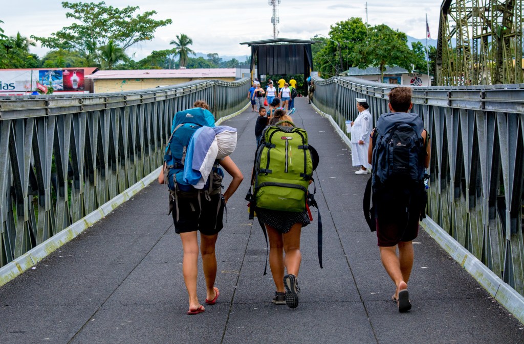 Bianca and Friends Crossing the Border to Costa Rica Immigration Office' - Join Bianca and her friends on their journey as they walk across the border to reach the Costa Rica immigration office. Explore the adventures of international travel.