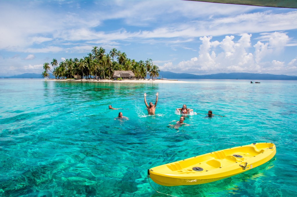 Crystal Clear Waters and Playtime in San Blas Islands' - Experience the joy of crystal clear waters and group play in the idyllic San Blas Islands. Immerse yourself in the transparent beauty of this tropical oasis.
