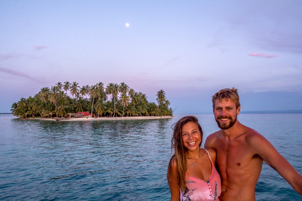 Bianca and Brett Smiling at Sunset, San Blas Islands' - Capture the magic of a serene sunset with Bianca and Brett in the enchanting San Blas Islands. Experience the joy of this romantic tropical getaway.