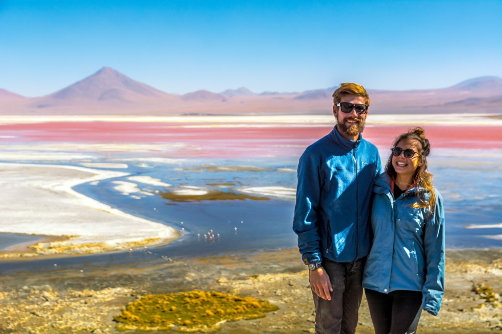 Image capturing Brett and Bianca posing amidst the stunning landscapes of Bolivia, showcasing the natural beauty and allure of this South American travel destination.