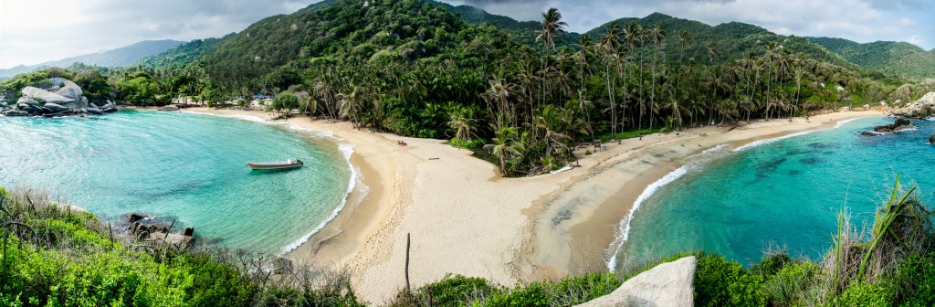 Tayrona National Park Panorama: A breathtaking view captured from the hut, overlooking the pristine twin beaches of Tayrona National Park. This enchanting panorama showcases the park's natural beauty and coastal splendor.
