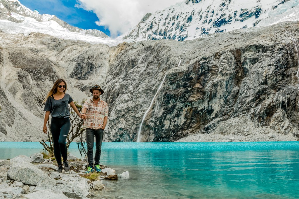 Image showcasing a stunning destination with vivid blue waters, inviting relaxation, and featuring a brave swimmer, Brett, enjoying the chilly waters.