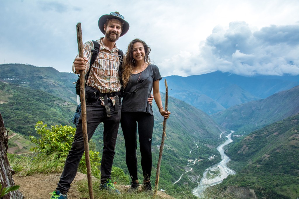 Image capturing Bianca and Brett taking a break on their trek to Machu Picchu, showcasing the journey's challenges and the determination to reach the iconic destination.