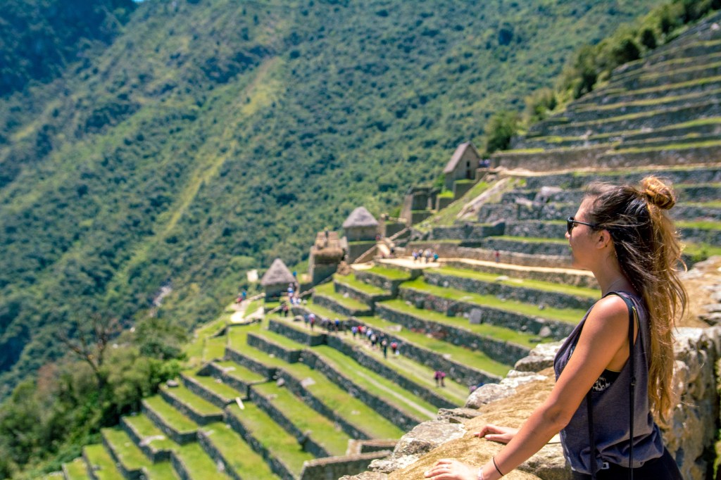 Image capturing Bianca mesmerized by the breathtaking view of Machu Picchu, showcasing the awe-inspiring beauty of the ancient Incan ruins.