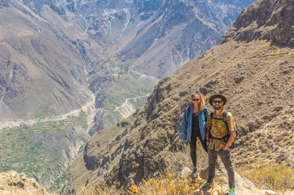Image showcasing Bianca and Brett hiking the renowned Colca Canyon in Peru, highlighting the adventurous spirit and stunning landscapes of this iconic destination.