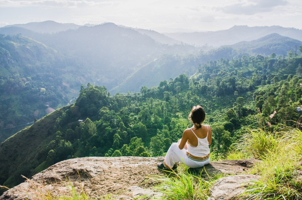 Image capturing Bianca enjoying the scenic view after ascending Little Adam's Peak for a sunset experience.