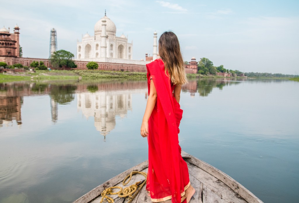 Serene boat ride along Yamuna River with Taj Mahal view