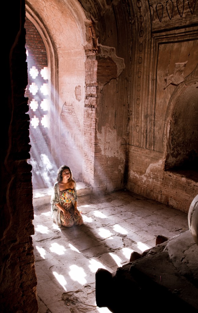 Bianca in Awe - Admiring Pagoda Statue in Bagan, Myanmar | Join Bianca's enchantment as she admires a captivating statue within a Bagan pagoda. A moment of cultural immersion in Myanmar's ancient allure.