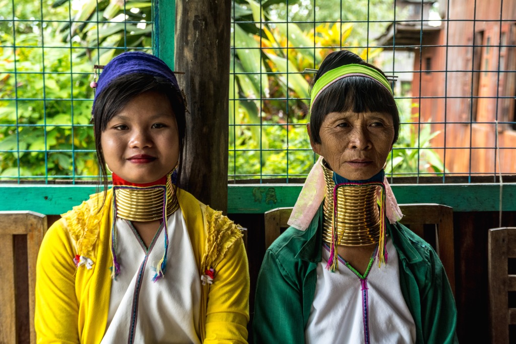Cultural Richness - Long Neck Karen People at Inle Lake Wearing Brass Neck Rings | Immerse in the heritage of the Padaung, Kayah, a sub-group of the Karen, as they adorn brass neck rings at Inle Lake. A captivating display of tradition, wealth, and beauty.