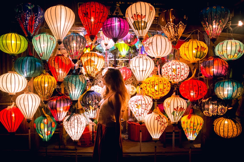 Bianca marveling at the captivating lanterns illuminating the night in Hoi An, Vietnam.