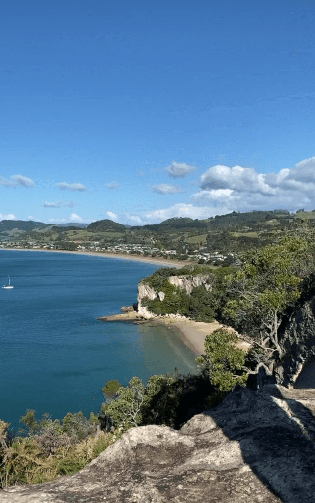 Lonely Bay, New Zealand, secluded beach accessible only by foot, untouched natural beauty