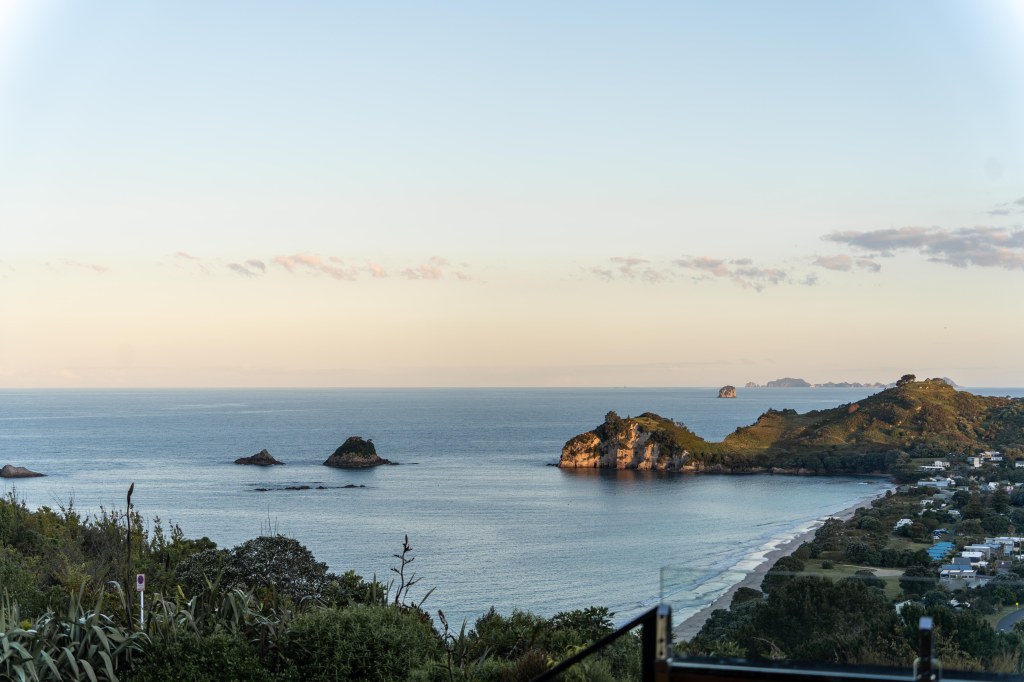 Stunning coastal view of Hahei Beach from Hahei Heights accommodation, New Zealand.