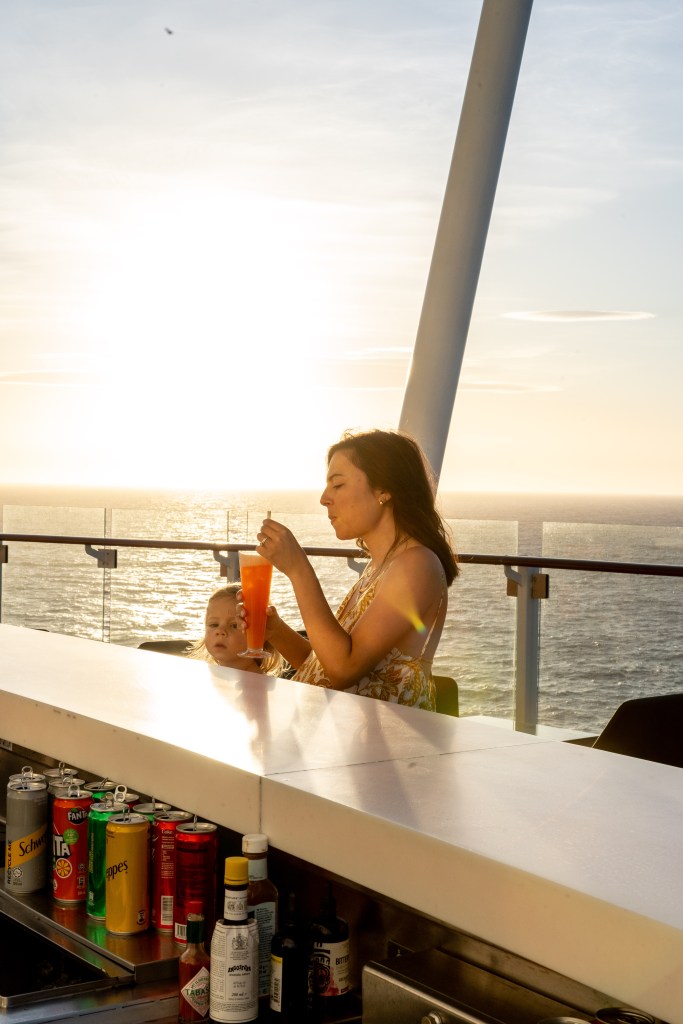 Colorful mocktails served on the bar deck of Celebrity Edge Cruise, enjoyed during a scenic family voyage from Auckland to Christchurch.