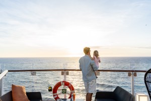 Brett and Florence watching a breathtaking sunset on the deck of Celebrity Edge Cruises during its inaugural trip to New Zealand, traveling from Auckland to Christchurch.