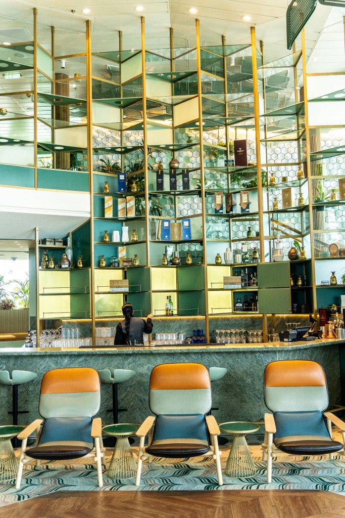 One of the many stylish bars on Celebrity Edge Cruise, offering a variety of drinks and a vibrant atmosphere during the New Zealand voyage.