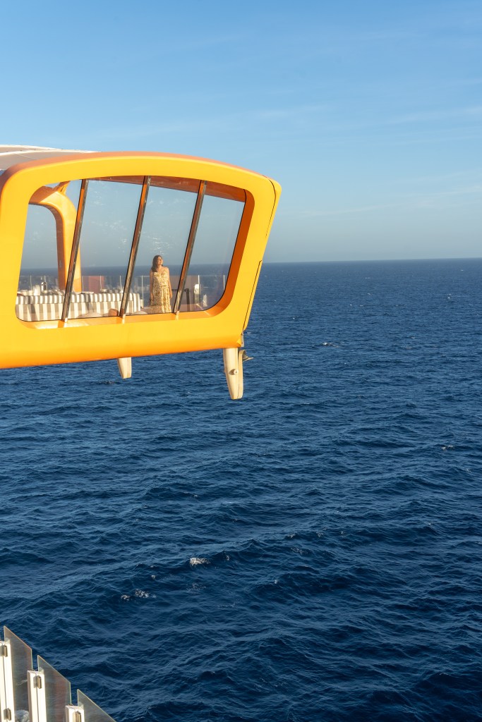 Scenic view from the deck of Celebrity Edge Cruise during its inaugural New Zealand voyage, showcasing the coastline and open sea.