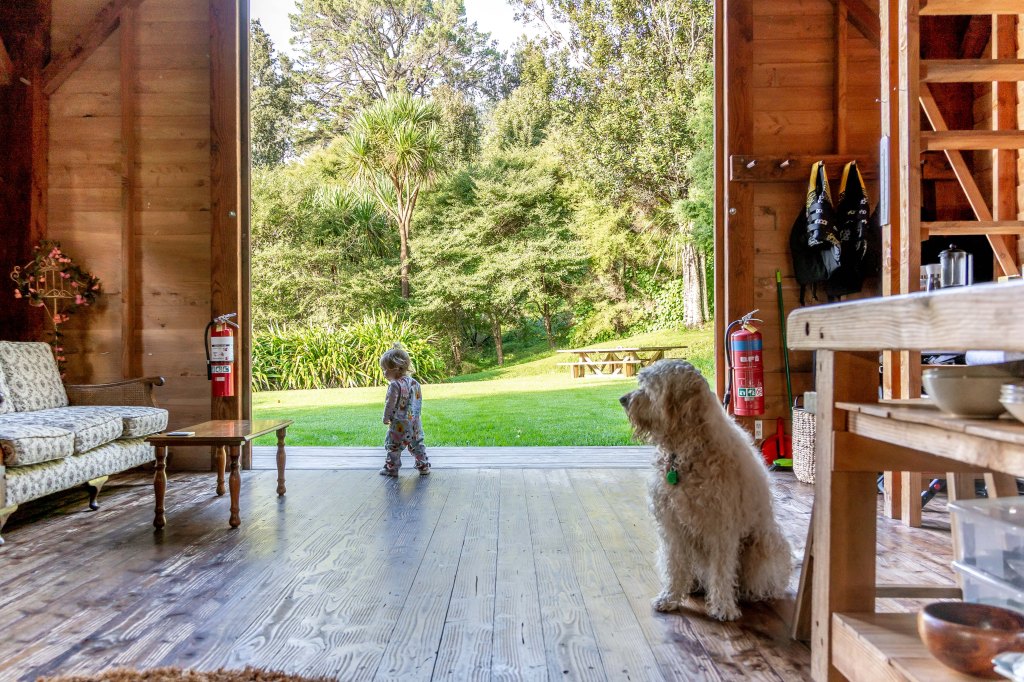 Family glamping adventure at Wainui Seaside Glamping in New Zealand, enjoying coastal views and outdoor living.