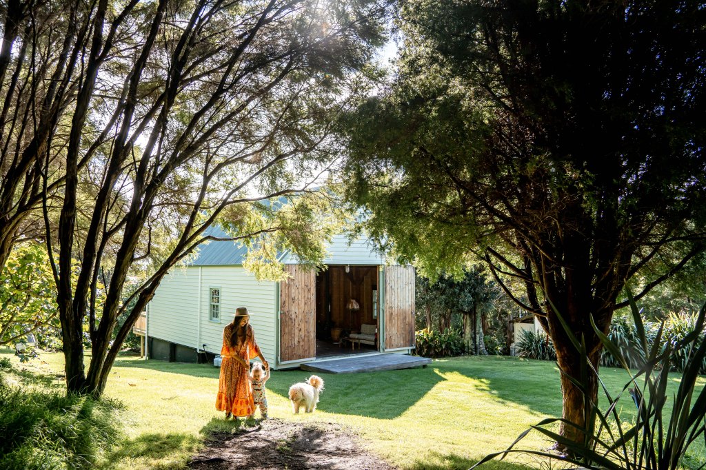 Family enjoying quality time together at Wainui Seaside Glamping in New Zealand, surrounded by coastal views and nature.