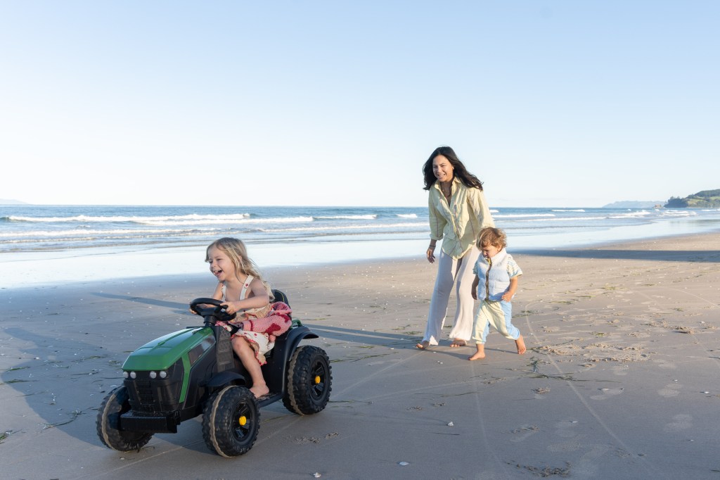 Bianca playing with her children at the beach, enjoying quality family time by the water.