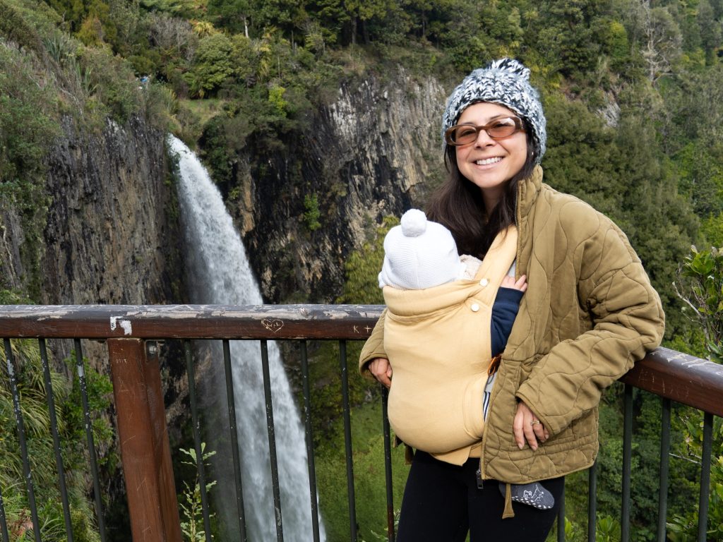 Bianca babywearing one of her babies in the Chekoh Clip Baby Carrier while out and about, showing a hands-free and comfortable carrying setup.