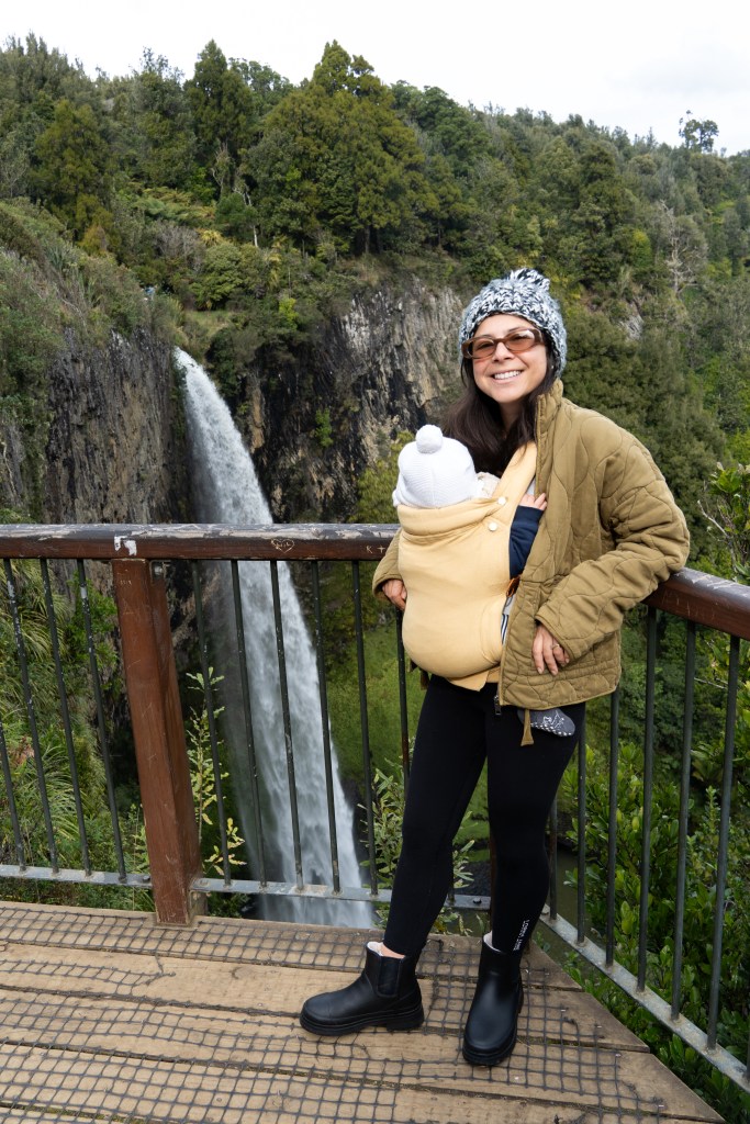 Bianca babywearing one of her babies in the Chekoh Clip Baby Carrier while out and about, showing a hands-free and comfortable carrying setup.
