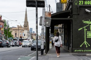 Bianca walking along a busy street in Brunswick, Melbourne.