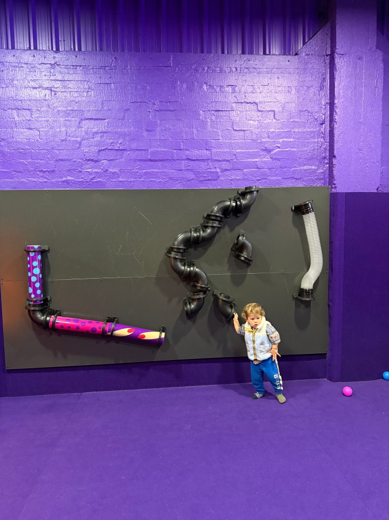 George enjoying interactive play and creative exhibits at MOPA (Museum of Play and Art) in Melbourne.