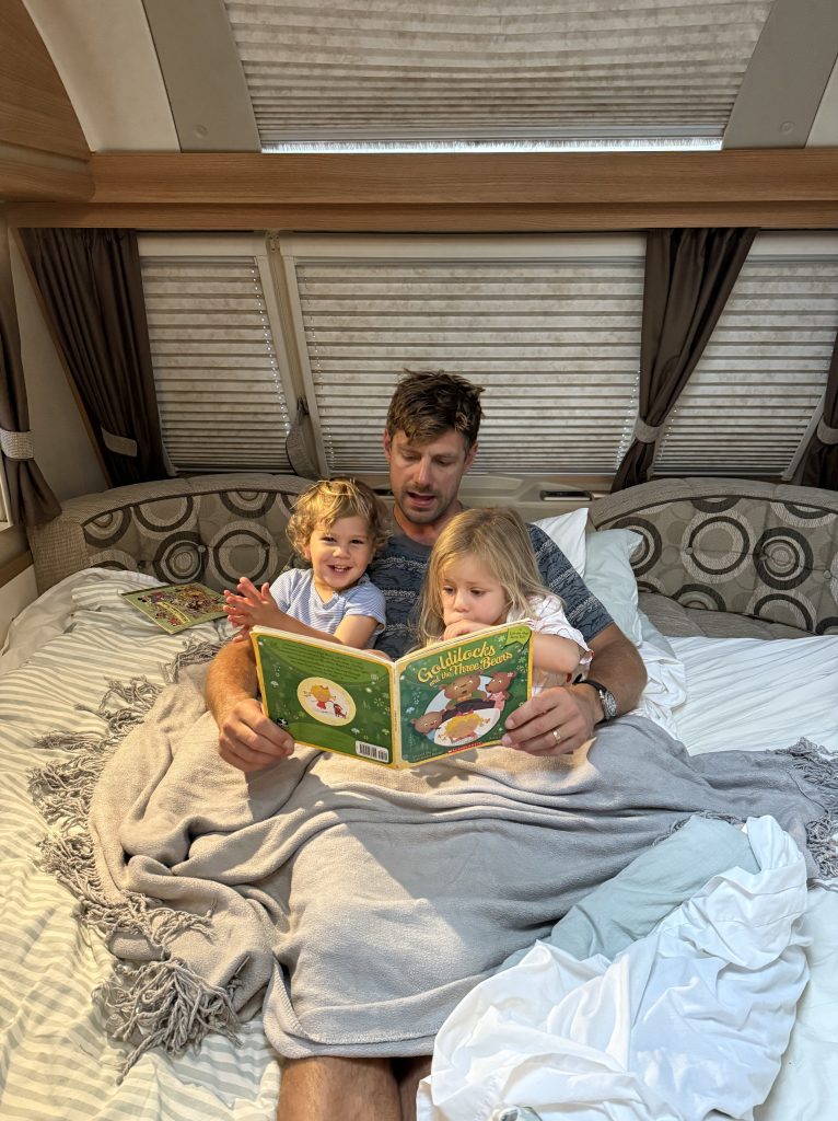 Brett reading a bedtime story to the kids as part of their nightly routine.